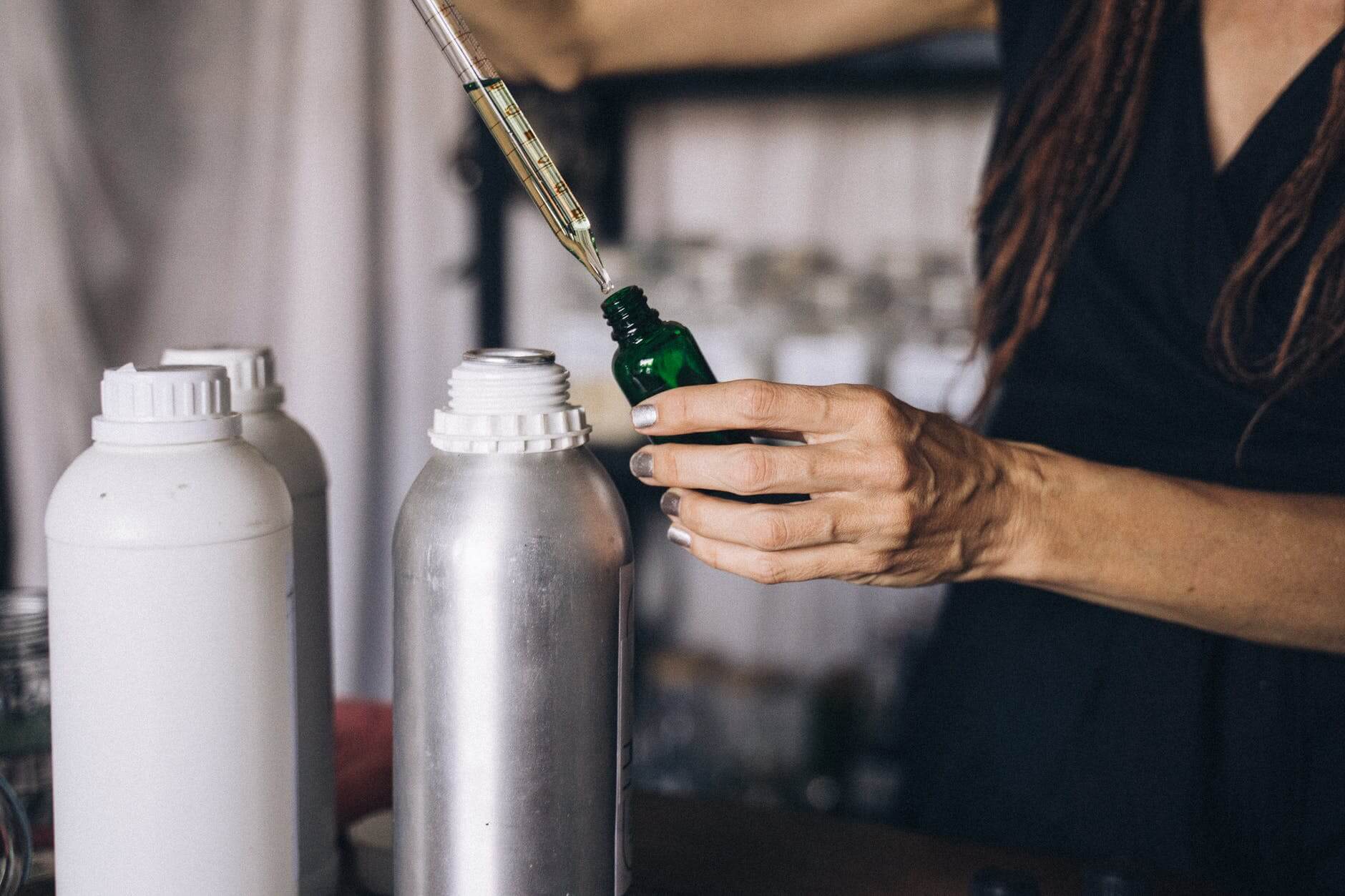 person holding stainless steel vacuum flask